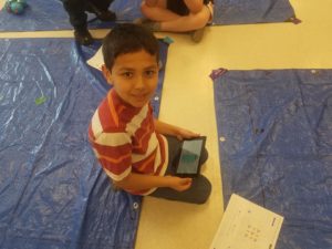 Child participating in coding lesson
