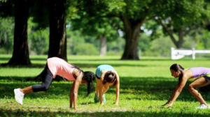 Women working out on a lawn