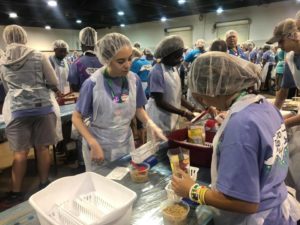 Union County 4-H Youth packing food for community drive
