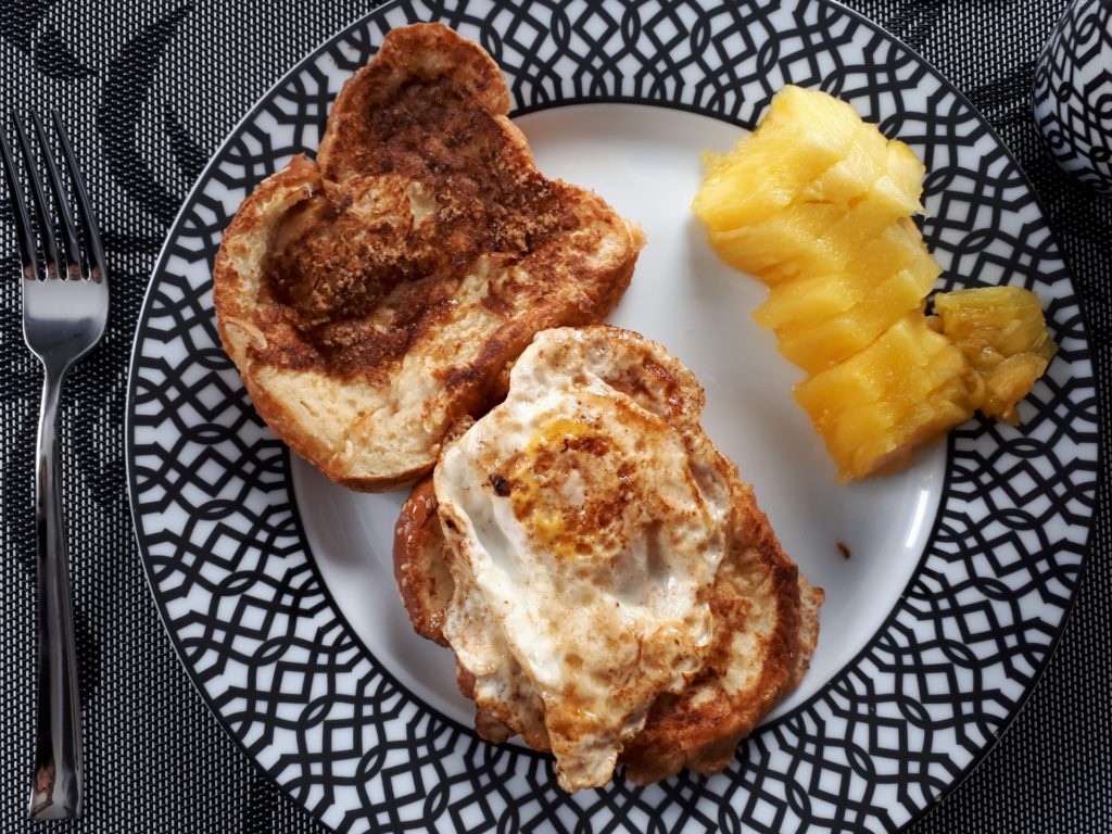 Breakfast plate with egg on toast and pineapple