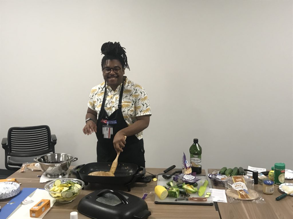 FCS Agent Marcus McFarland cooking for National Nutrition Month Event