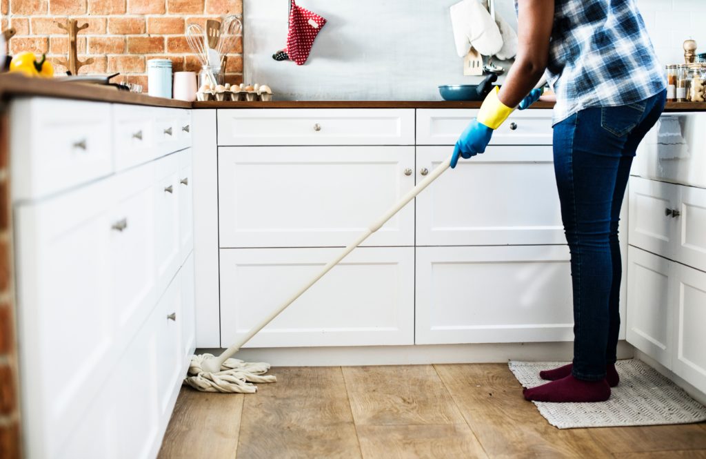 A Person Mopping the floor and housekeeping