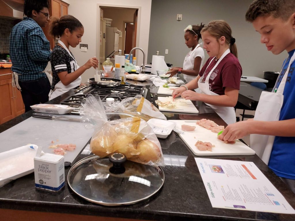 students cooking in Kid Chef Camp