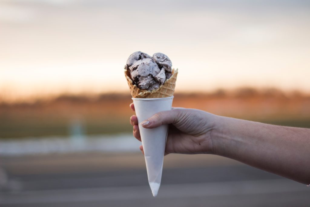 Hand holding ice cream cone