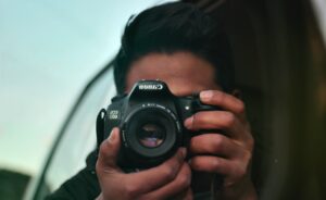 Man holding a black camera