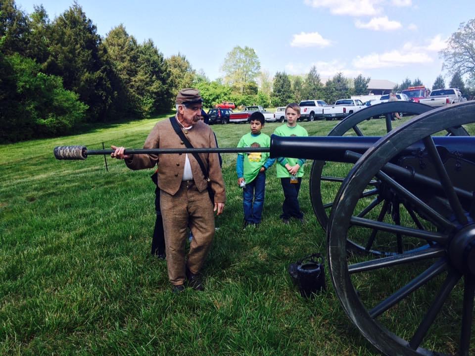 Man Loading Cannon