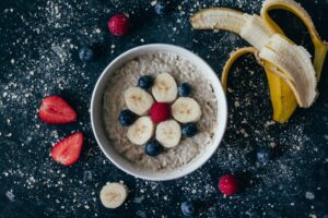 Bowl of Oatmeal with Bananas Blueberries and Raspberries