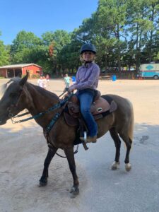4-H Flying Hooves Member riding a horse