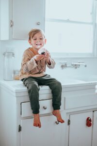 Child Eating Cupcake on Counter, How to Handle Picky Eaters, What to Do if my child will not eat, what to do if my child only wants sweets, what to do if my child will not eat their food, child not wanting to eat food, kids not eating dinner